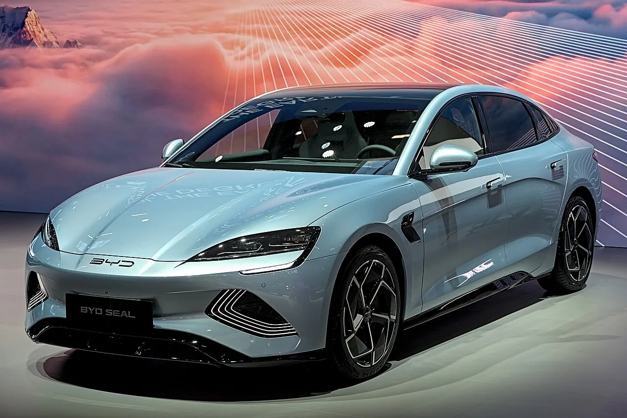 A pale blue BYD Seal electric sedan on a motor show stand
