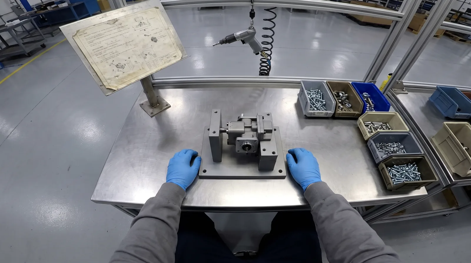 First-person view of hands at an assembly station