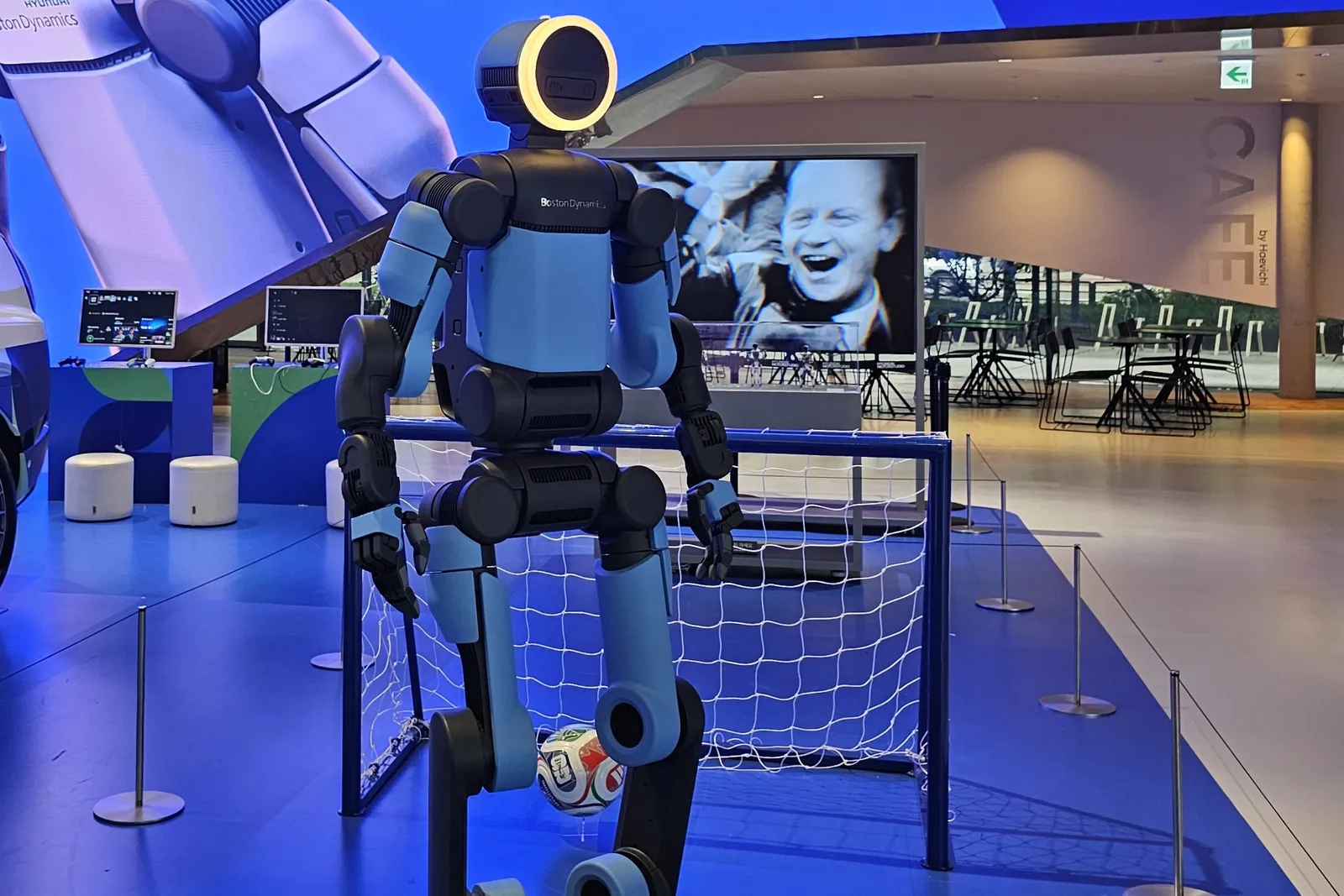 Boston Dynamics' Atlas humanoid robot standing on display in front of a small football goal