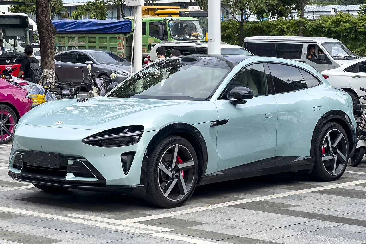 Pale green Xiaomi YU7 SUV parked on a street