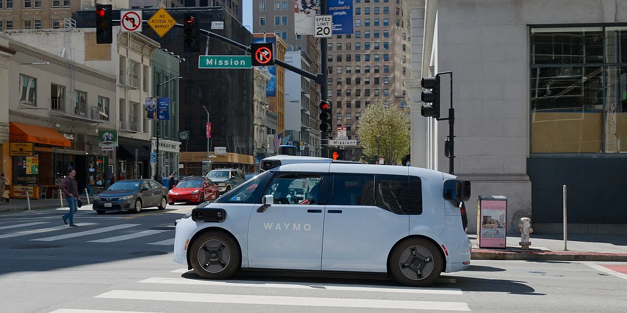 Waymo Ojai robotaxi built on the Zeekr platform, on Mission Street in San Francisco